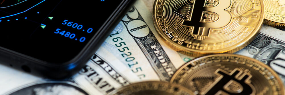 Bitcoin,Cryptocurrency,Coins,And,Us,Dollar,Banknotes,Next,To,Mobile
