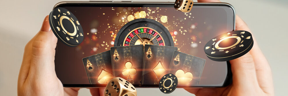 Creative,Background,,Online,Casino,,In,A,Man’s,Hand,A,Smartphone