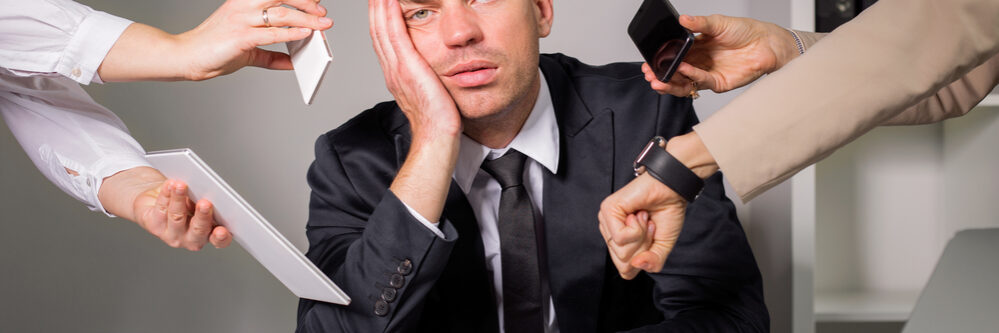 Tired,Man,Being,Overloaded,At,Work