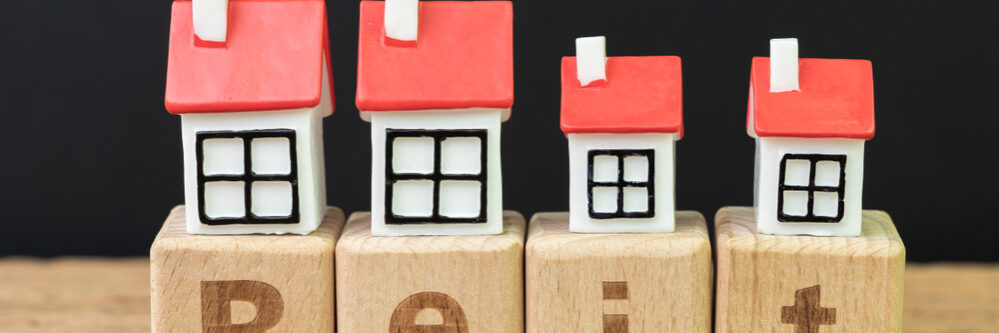 Reit,,Real,Estate,Investment,Trust,Concept,,Miniature,Houses,On,Cube